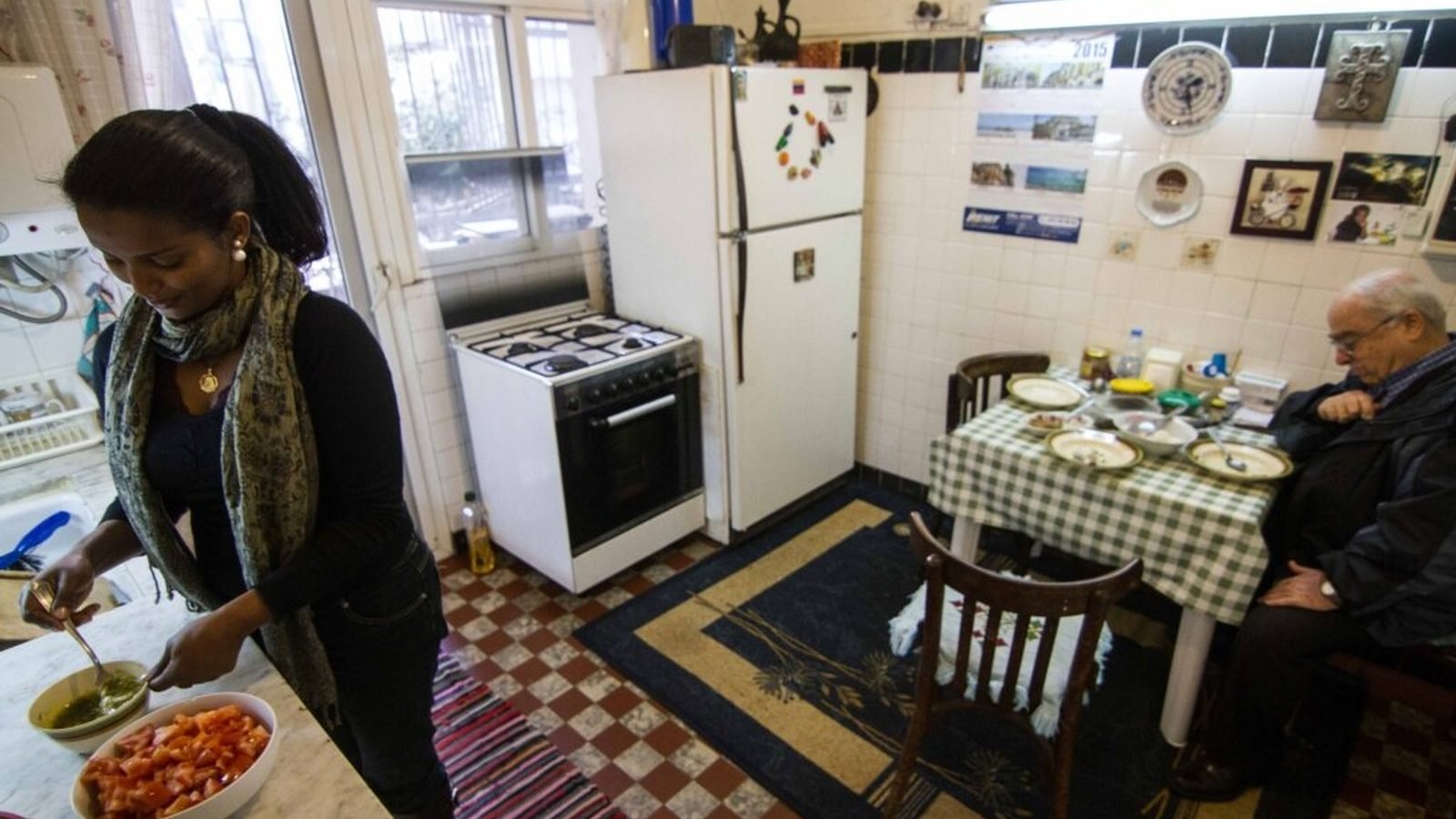 A migrant domestic worker preparing food in a home in Lebanon